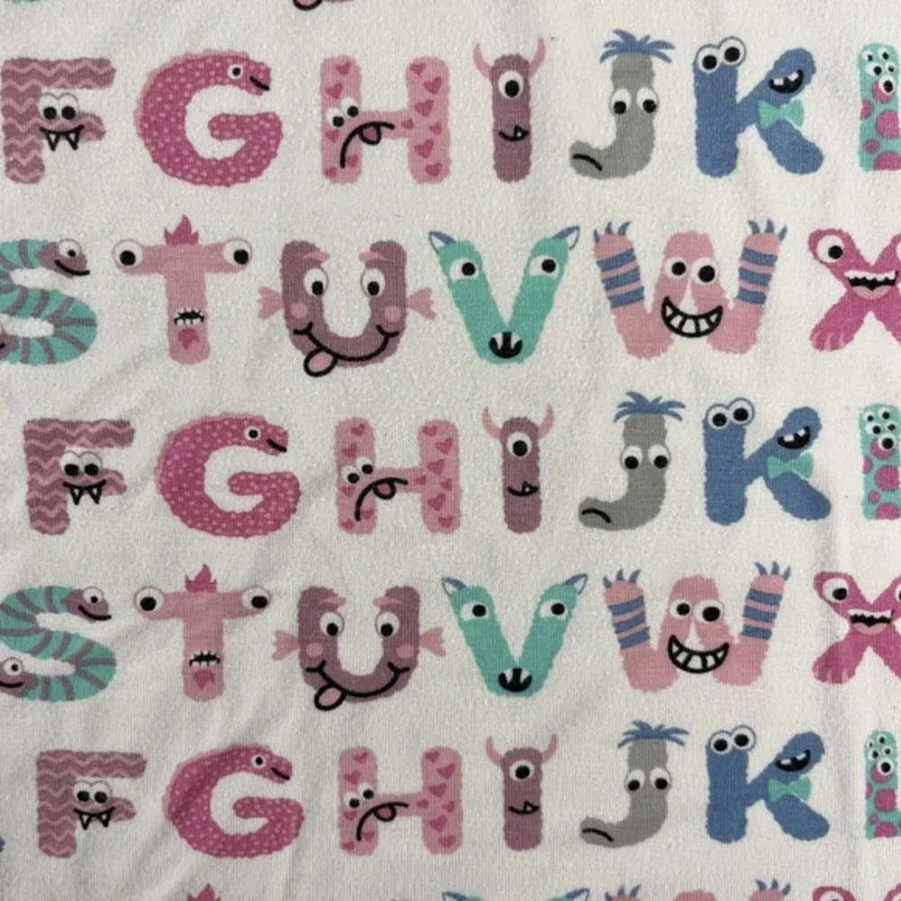KicKee Graphic Short Sleeve Pajama Set, Ultra Soft and Snug Natural ABC Monsters
